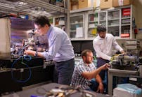 Sandia National Laboratories’ Scientist Jongmin Lee (left) prepares a rubidium cold-atom cell for an atom interferometry experiment while Scientists Ashok Kodigala (right) and Michael Gehl initialize the controls for a packaged single-sideband modulator chip.