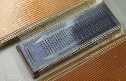 Photo of the quantum photonic chip that predicts the chemical properties of molecules.